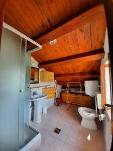 a bathroom with two toilets and a sink at Apartment Mirjana in Nerezine
