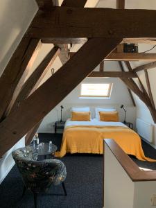 En eller flere senge i et værelse på Logement de Spaerpot