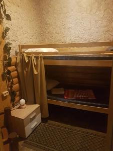 a room with a bunk bed with a desk and a sink at Hostel P33 in Tallinn