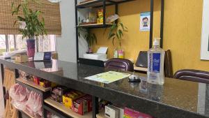 a counter with a bottle of alcohol on top of it at Hostel Ipê in Sao Paulo