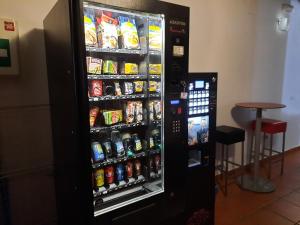 a vending machine filled with lots of food and drinks at La Casa de Mi Abuela in Aldeanueva del Camino