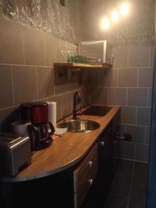 a kitchen with a sink and a counter top at Apartment Angelika in Zell am See