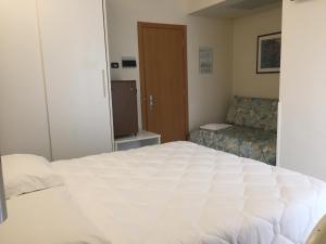 Postel nebo postele na pokoji v ubytování Hotel Consuelo