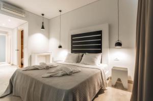 Posteľ alebo postele v izbe v ubytovaní Belussi Exclusive Suites