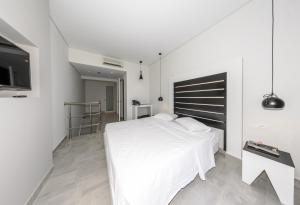 Posteľ alebo postele v izbe v ubytovaní Belussi Exclusive Suites