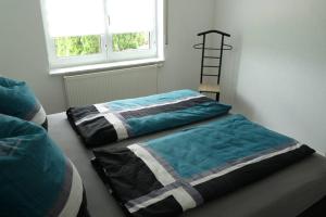 Postel nebo postele na pokoji v ubytování Ferienwohnung Schwarzwaldrand
