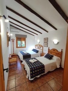 מיטה או מיטות בחדר ב-Complejo La Veguilla
