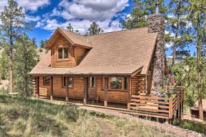 a log cabin in the woods at Quiet Guffey Getaway with Private Deck, Pond and Canoe in Guffey