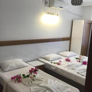 Ліжко або ліжка в номері Altunakar 1 Hotel