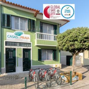 a group of bikes parked in front of a building at Casas da Praia by Aqualeisure in Furadouro