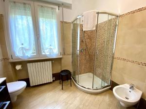 a bathroom with a shower and a sink at Casa Lavanda in Torri del Benaco +25 photos