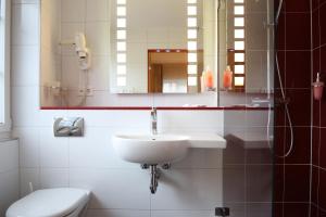 Koupelna v ubytování Ambiente Hotel Freieck + 37 fotografií