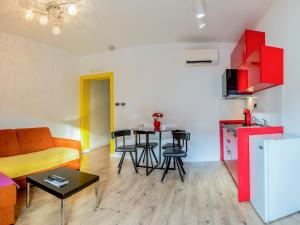 a living room with a couch and a table at Apartments Windrose in Kotor