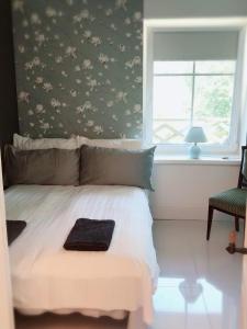Cama ou camas em um quarto em Villa Kertelhof Guesthouse