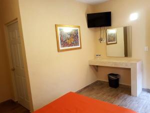 Postel nebo postele na pokoji v ubytování Hotel Camino de Piedra