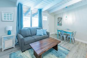 a living room with a couch and a table at Boutique Suite #7 in Blue Mountains