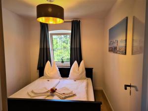 Ein Bett oder Betten in einem Zimmer der Unterkunft Gästehaus Kirmerschneiderhof bei Erding