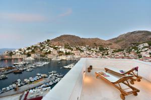 a view of a marina from the balcony of a house at Onar Hydra in Hydra