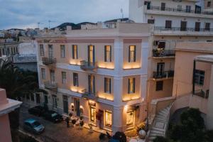 a view of a building with lights on at 5 Hermoupolis Concept Sites in Ermoupoli