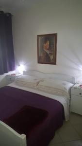 Postel nebo postele na pokoji v ubytování Villa Rosa
