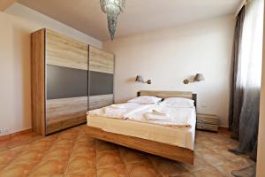 En eller flere senge i et værelse på Slavia by Baltic Home