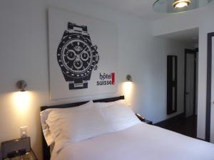 Postel nebo postele na pokoji v ubytování Swiss Hotel
