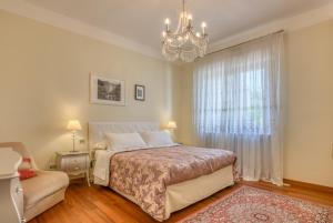 Łóżko lub łóżka w pokoju w obiekcie Hotel Villa De Santis