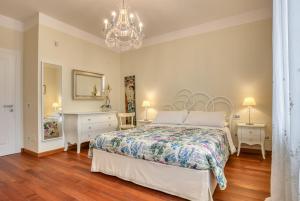 Łóżko lub łóżka w pokoju w obiekcie Hotel Villa De Santis