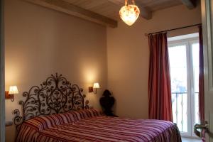 Posteľ alebo postele v izbe v ubytovaní Casa Tarò