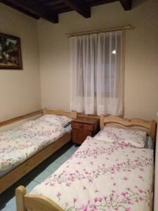 Posteľ alebo postele v izbe v ubytovaní Agroturystyka w ogrodach