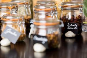 a group of jars of pickles on a table at Domein Fonteinhof B&B in Borgloon +43 photos
