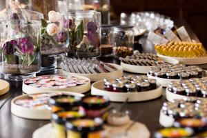 a table topped with lots of different types of desserts at Domein Fonteinhof B&B in Borgloon