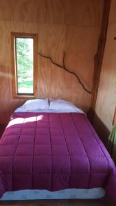 Una cama o camas en una habitación de Rustico Pucon