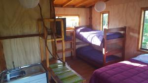 Una cama o camas en una habitación de Rustico Pucon