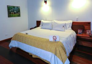 Cama o camas de una habitación en Hotel Casa de los Fundadores
