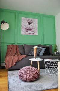 a living room with a couch and a table at Mateja Apartment in Novi Sad