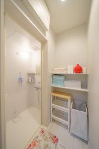 a bathroom with a walk in shower next to a toilet at Osaka Yeon House in Osaka