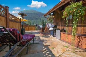 a patio with a bench and a view of a mountain at Galena Chalet - Valley View 1 Br 1 Ba 2 Half Ba Sleeps 6 in Telluride
