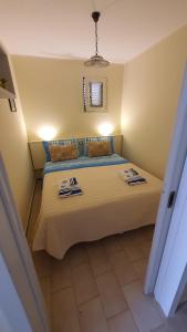 Ένα ή περισσότερα κρεβάτια σε δωμάτιο στο Casa vacanze "Il Carrubo" +66 φωτογραφίες
