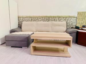 a coffee table and a couch in a room at lolf with jacuzzi in malaga in Málaga