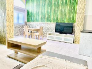 A television and/or entertainment centre at lolf with jacuzzi in malaga