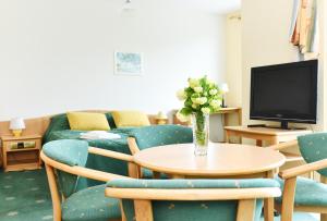 TV a/nebo společenská místnost v ubytování Apartament 14A