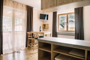 TV a/nebo společenská místnost v ubytování Apartments Gletscherblick