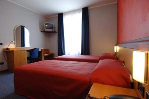 Postel nebo postele na pokoji v ubytování Hotel Residence Ducale