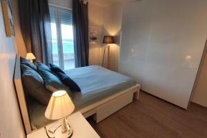 A bed or beds in a room at Il Mare in Casa - Appartamento al mare in Puglia