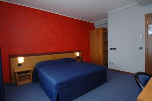 Postel nebo postele na pokoji v ubytování Hotel Residence Ducale