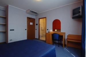 Postel nebo postele na pokoji v ubytování Hotel Residence Ducale
