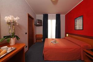 Postel nebo postele na pokoji v ubytování Hotel Residence Ducale