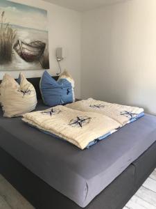 Postel nebo postele na pokoji v ubytování Ostseeperle