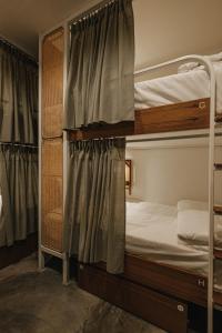 Ein Bett oder Betten in einem Zimmer der Unterkunft Hidden Garden Hostel